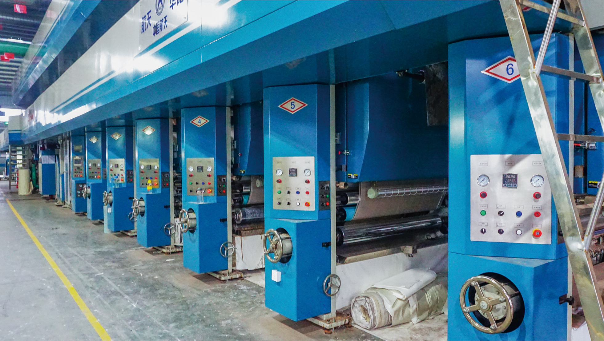 Wallpaper and wall covering making machines