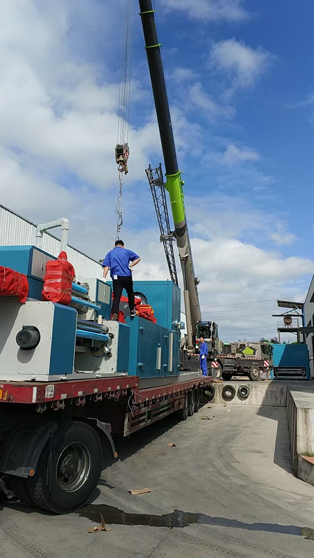 Crane installing new wallcovering production line equipment at Bauhinia Walls